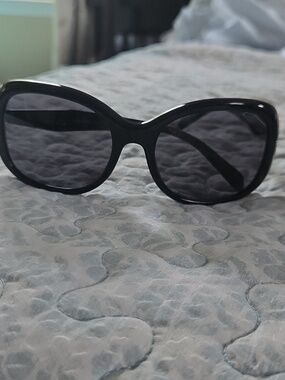 Prada Glossy Black Rounded Frame Sunglasses